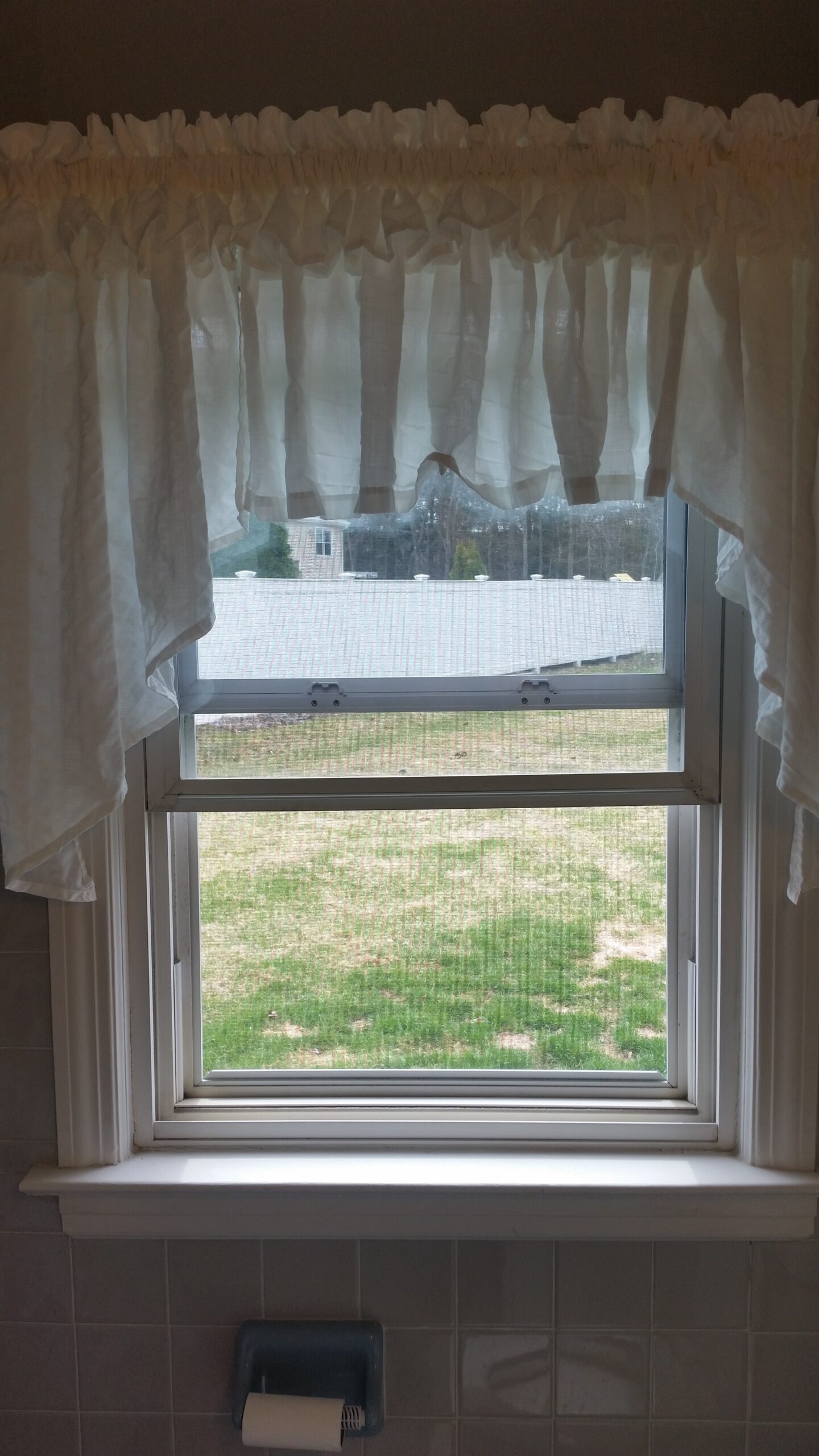 Bathroom window with fixed latches.